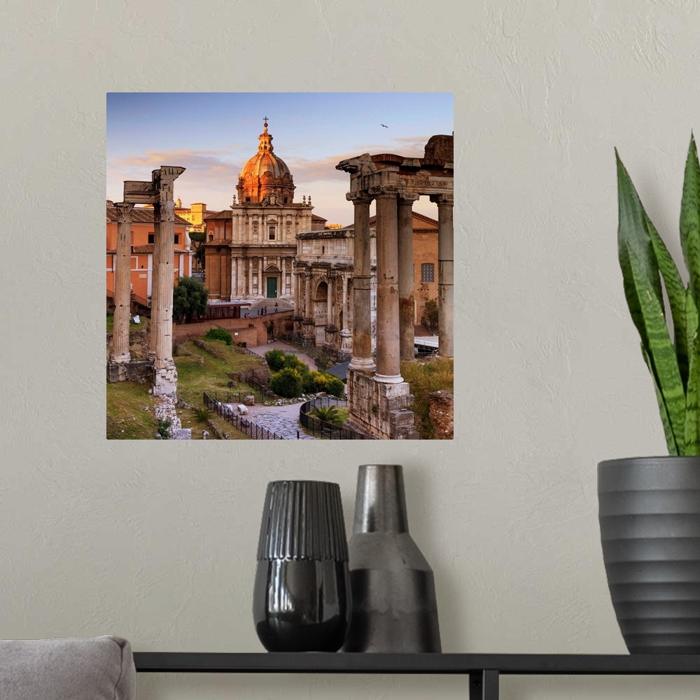 A modern room featuring Italy, Rome, Colosseum and Roman Forum at sunset