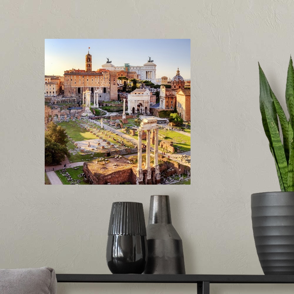 A modern room featuring Italy, Rome, Roman Forum and Altare della Patria monument at sunset
