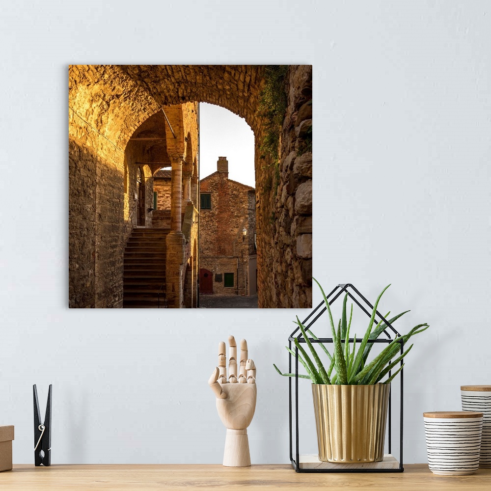 A bohemian room featuring Italy, Tuscany, Suvereto. Medieval town center at sunset.