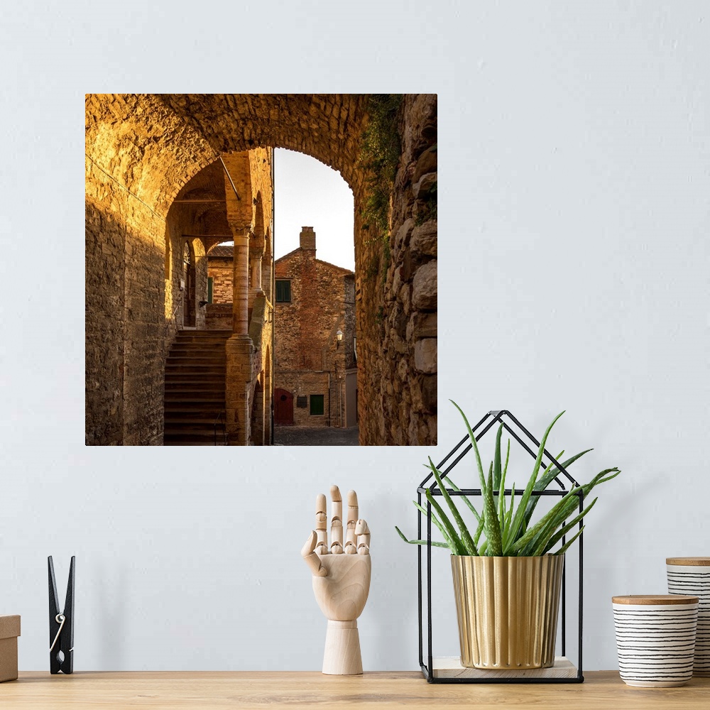A bohemian room featuring Italy, Tuscany, Suvereto. Medieval town center at sunset.