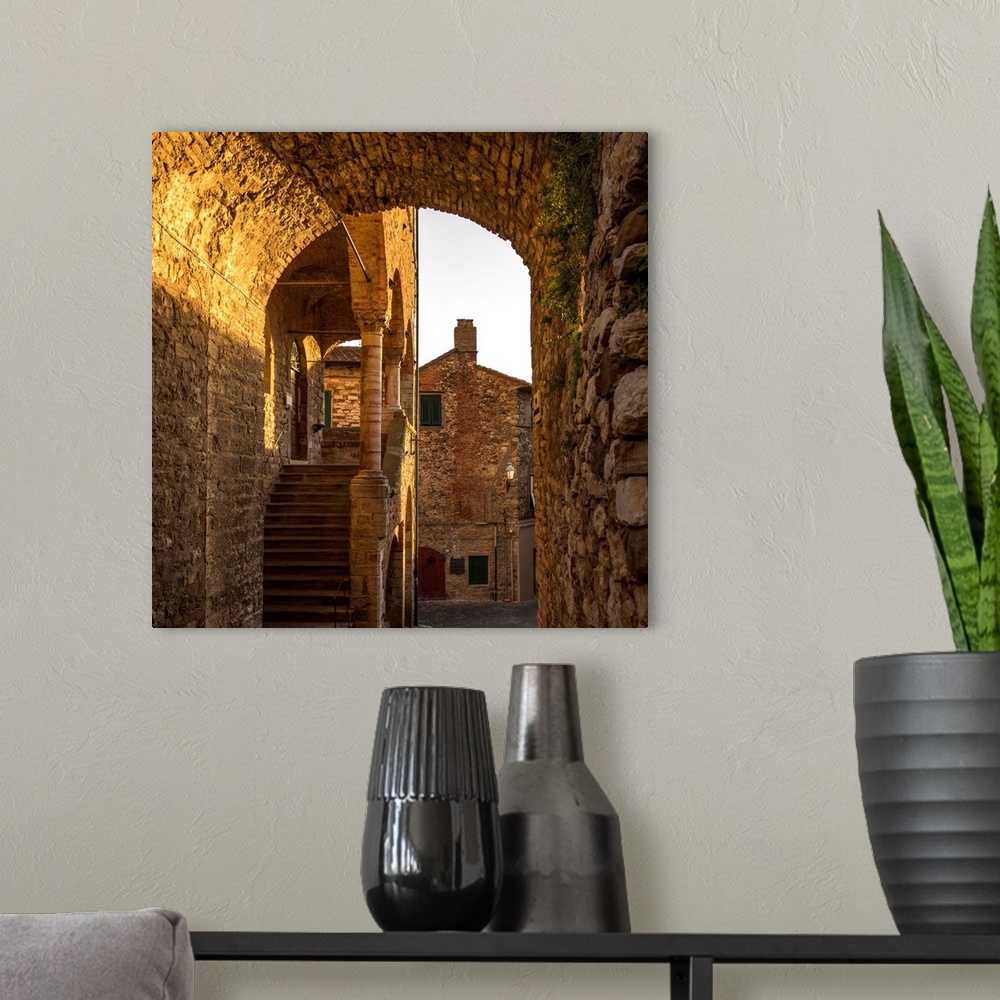 A modern room featuring Italy, Tuscany, Suvereto. Medieval town center at sunset.