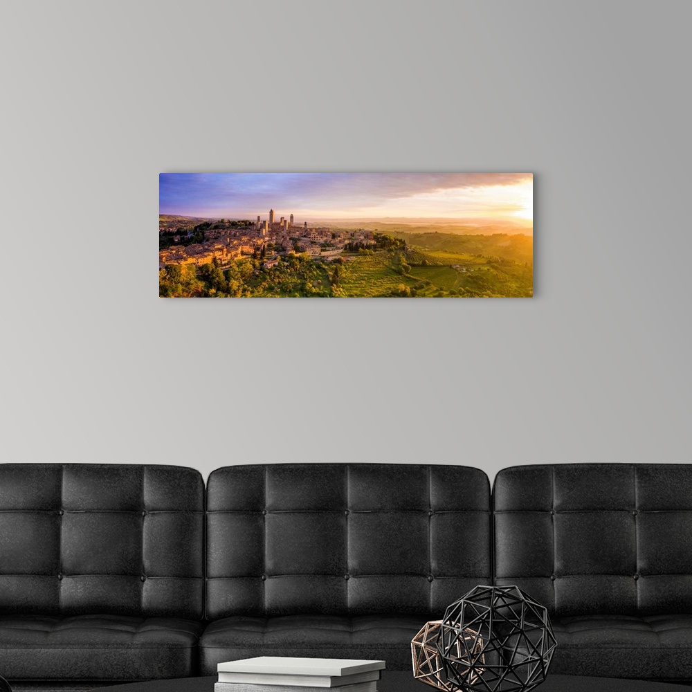 A modern room featuring Italy, Tuscany, Val d'Elsa. Panoramic aerial view of the medieval village of San Gimignano, a UNE...