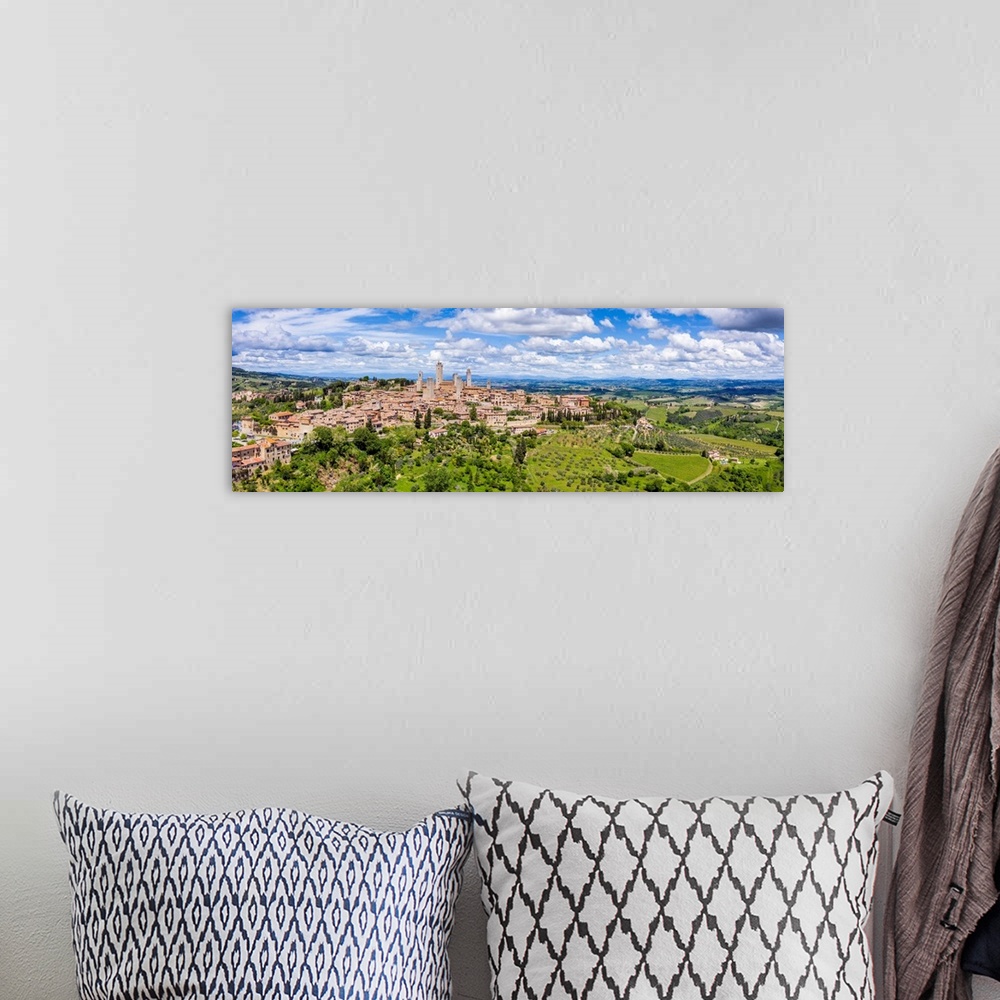 A bohemian room featuring Italy, Tuscany, Val d'Elsa. Panoramic aerial view of the medieval village of San Gimignano, a UNE...