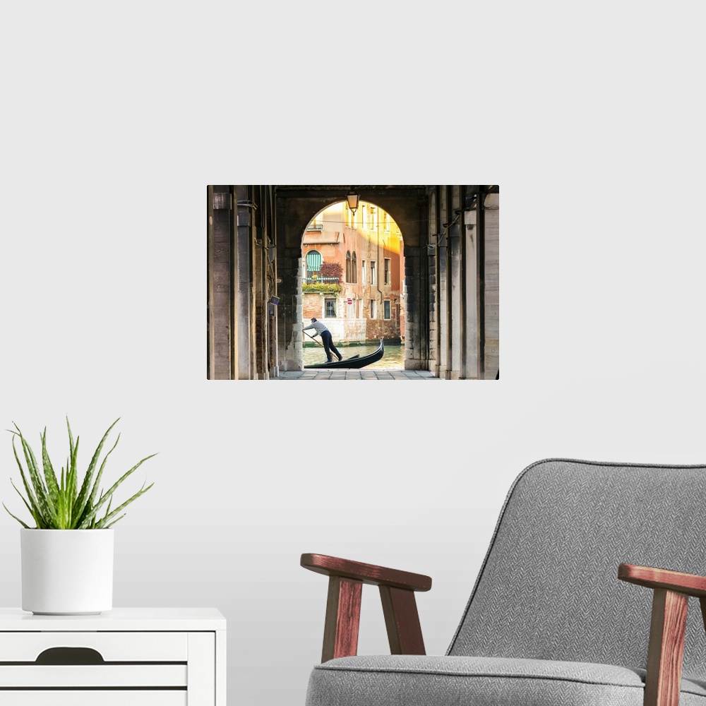 A modern room featuring Italy, Veneto, Venice. Gondola passing on Grand canal seen from a colonnade