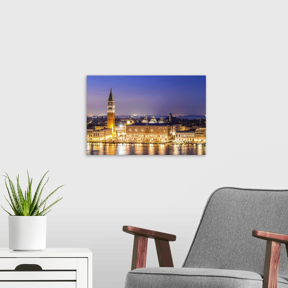 A modern room featuring Italy, Veneto, Venice. High angle view of the city at dusk