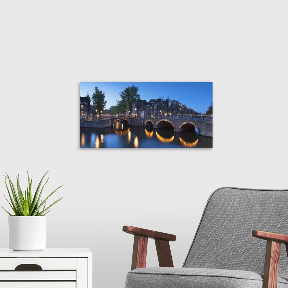 A modern room featuring Keizersgracht canal at dusk, Amsterdam, Netherlands