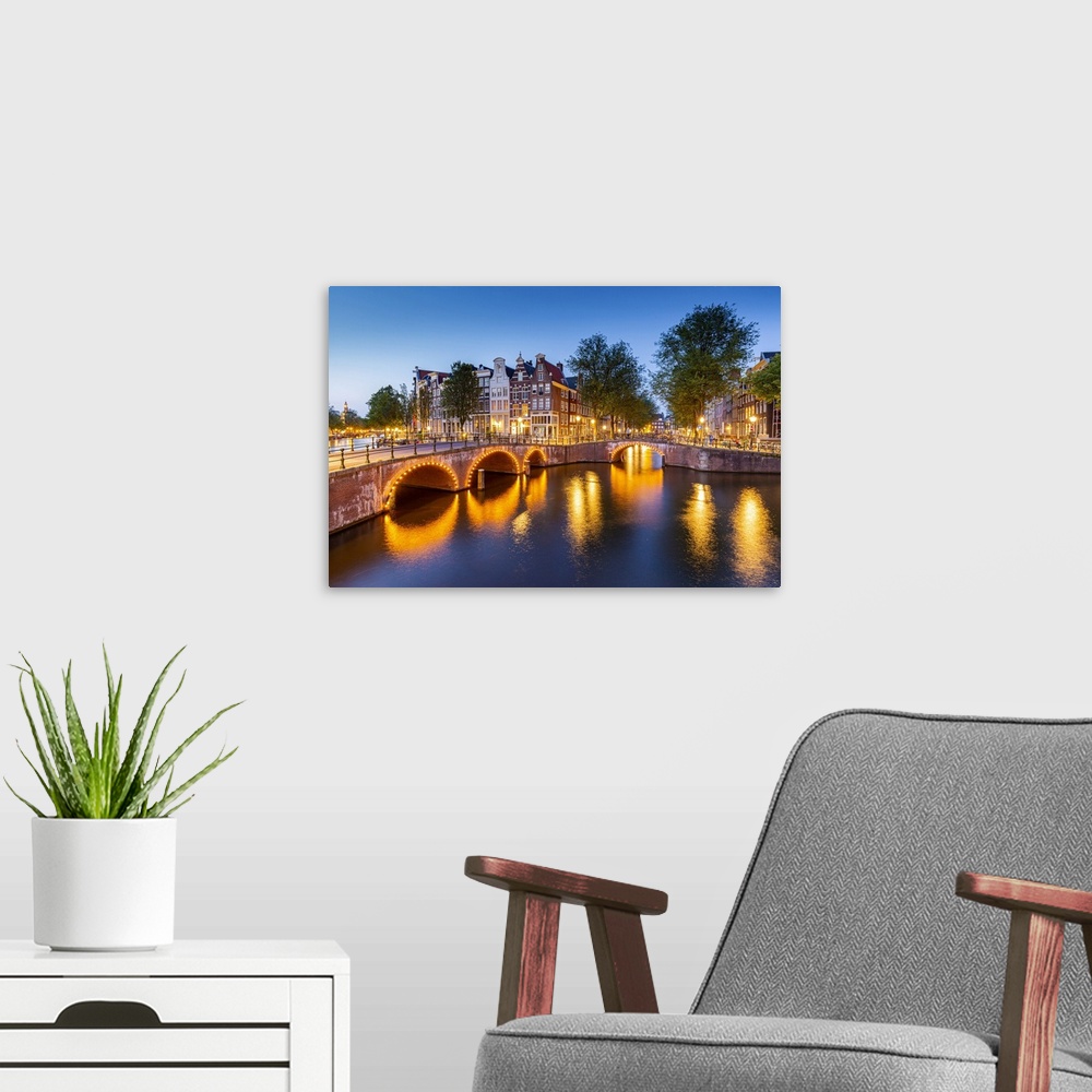 A modern room featuring Keizersgracht canal at dusk, Amsterdam, North Holland, Netherlands.
