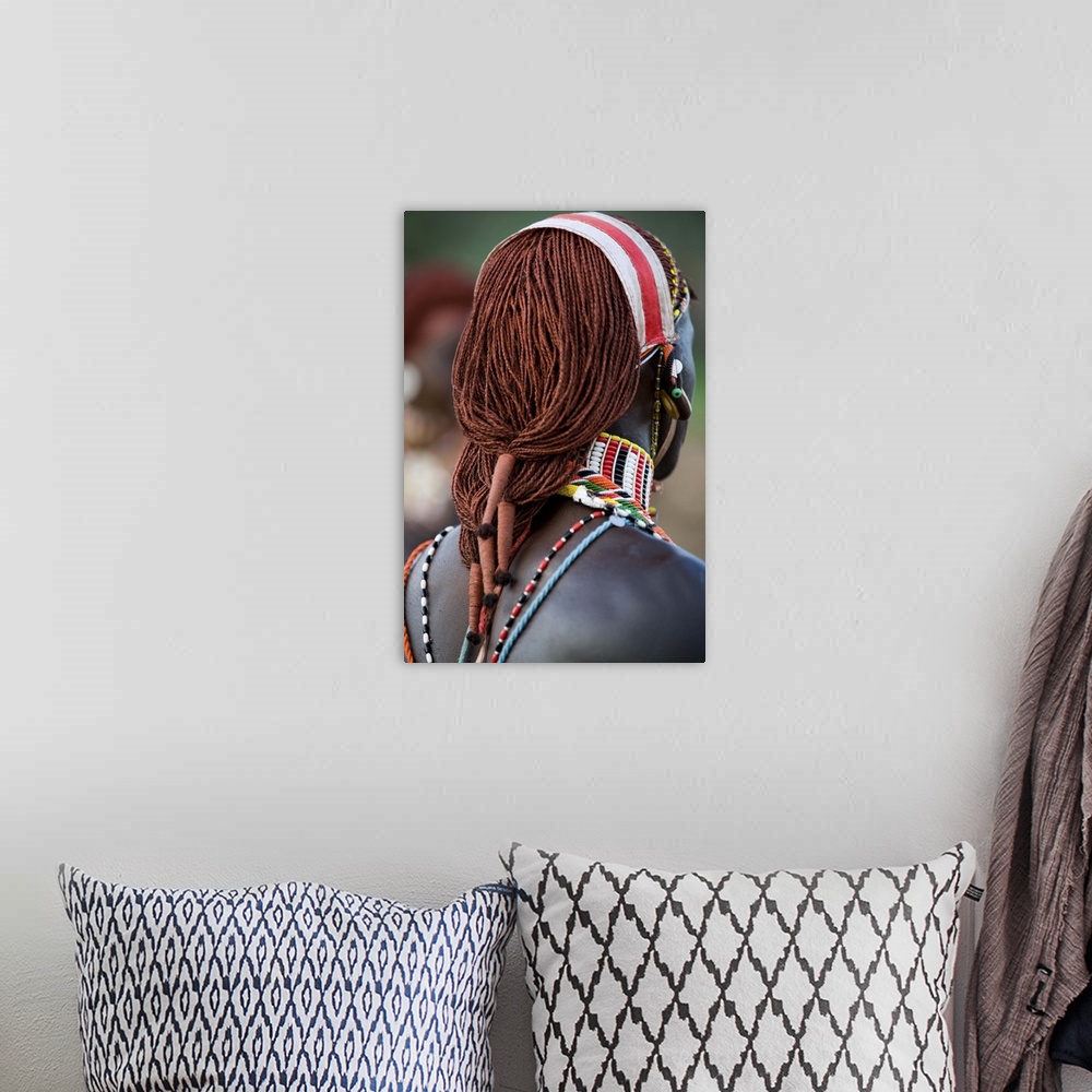 A bohemian room featuring Kenya, Laikipia, Ol Malo. A Samburu warrior's hair is ochred and tied up in braids at a dance at ...