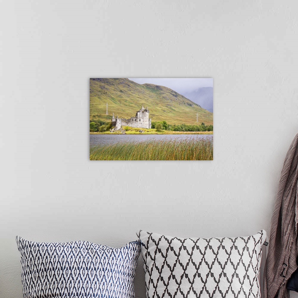 A bohemian room featuring Kilchurn Castle on Loch Awe, Scotland.