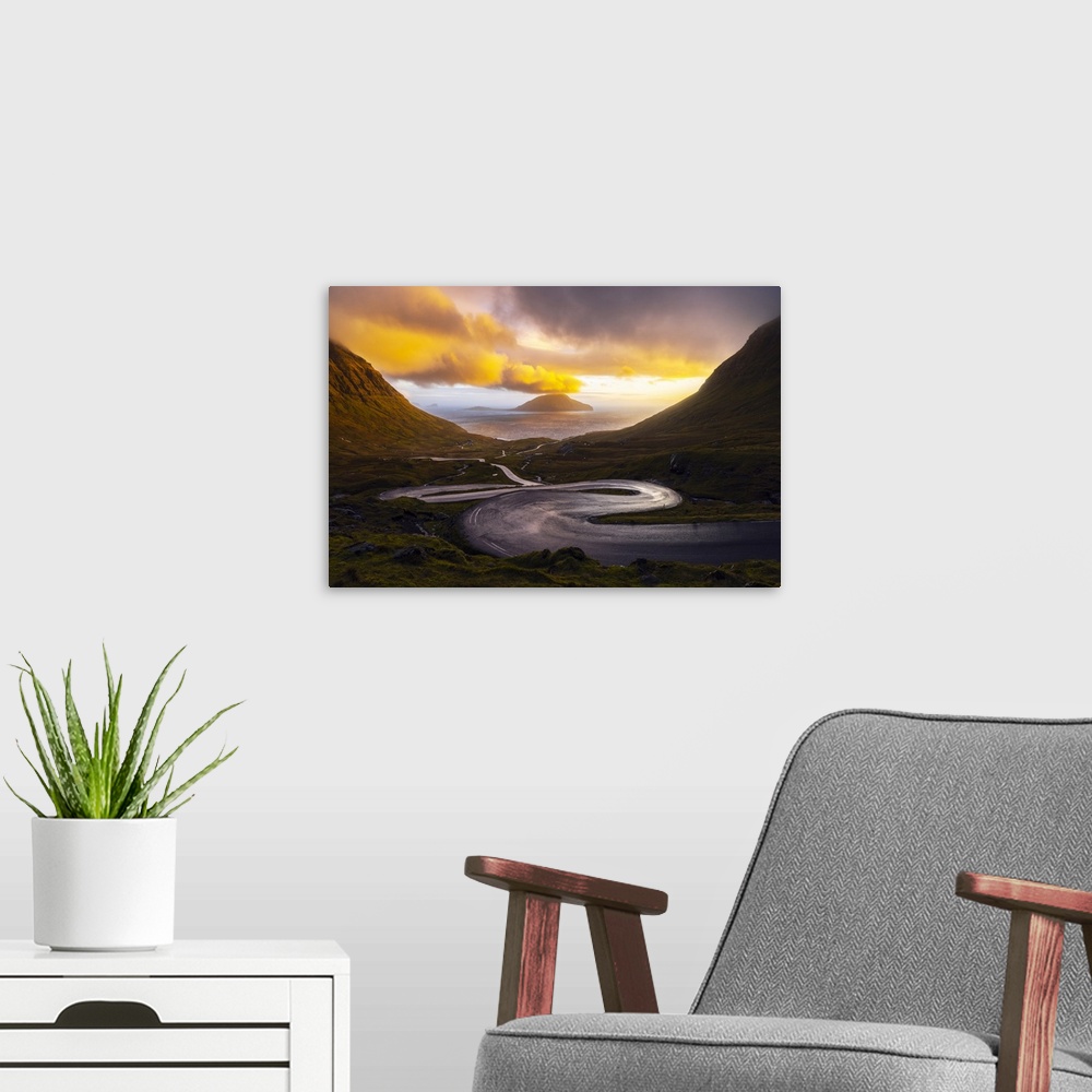 A modern room featuring Koltur island with a bendings road in the foreground, Streymoy, Torshavnar municipality, Faroe Is...