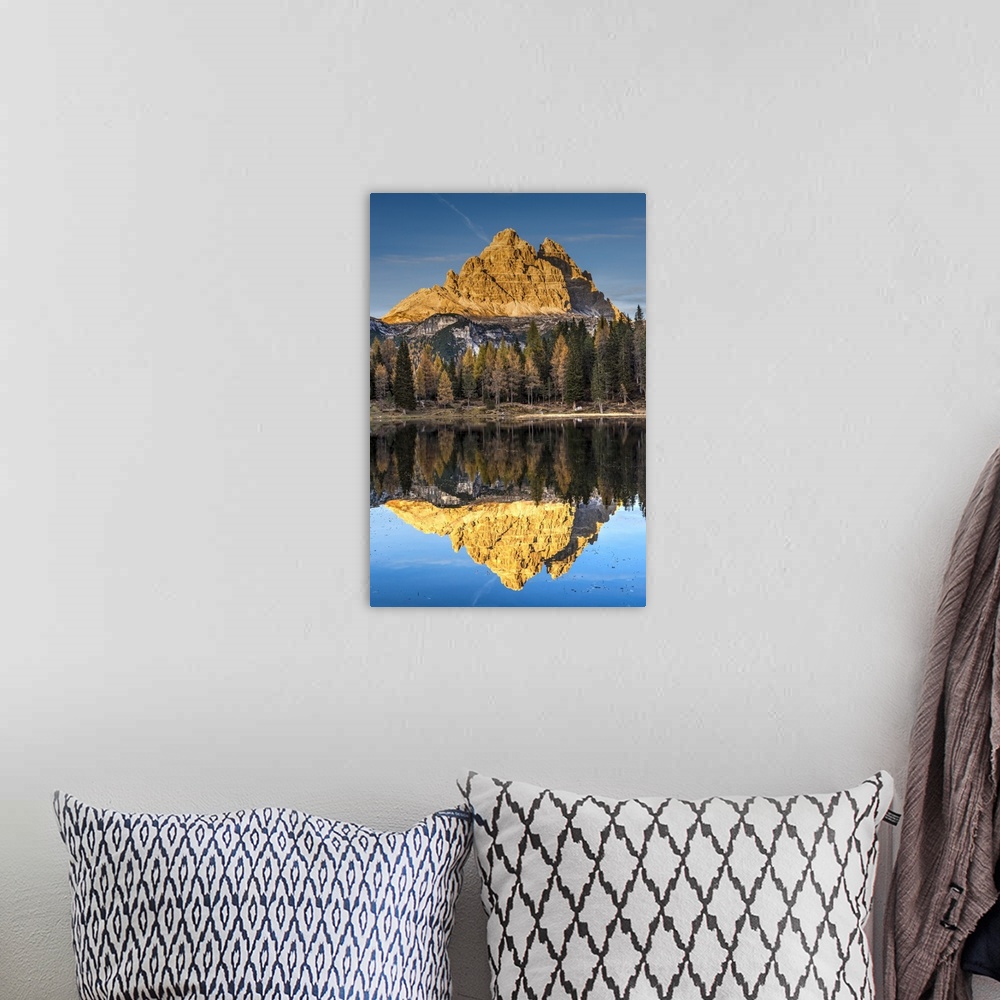 A bohemian room featuring Lake d'Antorno with Tre Cime di Lavaredo mountain group reflected in its waters, Misurina, Veneto...