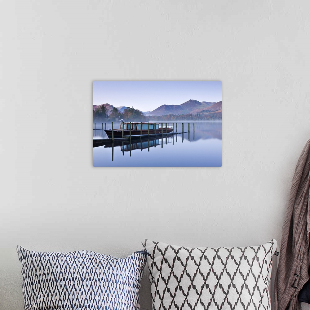 A bohemian room featuring Lakeland Mist pleasure boat moored on a placid Derwent Water on a misty and frosty morning, Keswi...