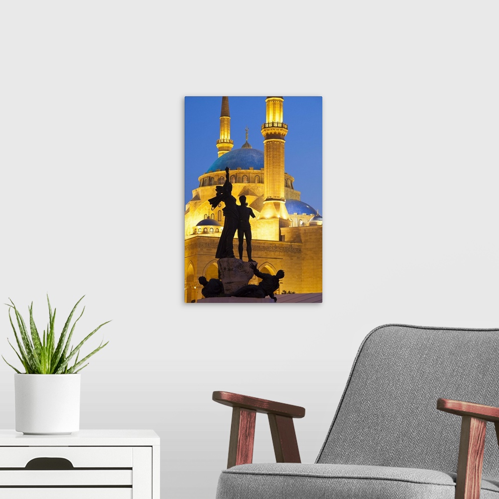A modern room featuring Lebanon, Beirut. Statue in Martyr's Square and Mohammed Al-Amin Mosque at dusk.