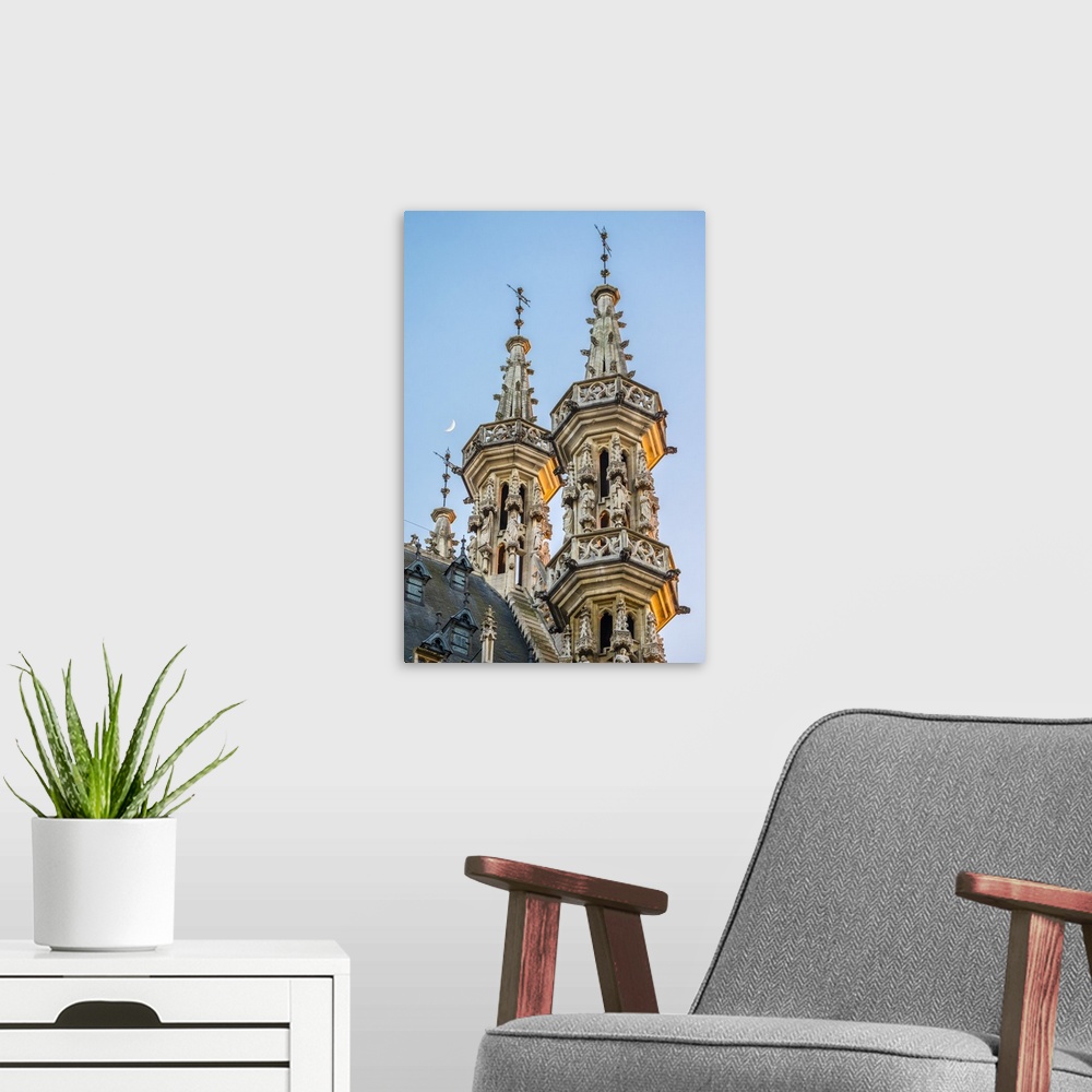 A modern room featuring Leuven Stadhuis (City Hall) and buildings on Grote Markt, Leuven, Flemish Brabant, Flanders, Belg...