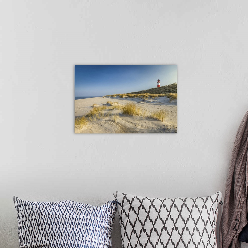 A bohemian room featuring List-Ost lighthouse and beach on the Ellenbogen Peninsula, Sylt, Schleswig-Holstein, Germany.