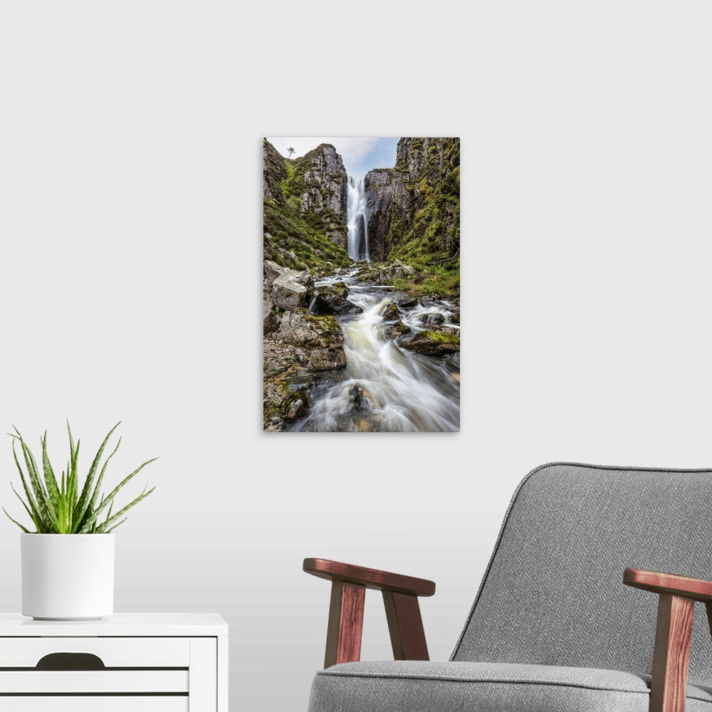 A modern room featuring Loch na Gainmhich Waterfall, Sutherland, Highlands, Scotland, United Kingdom.