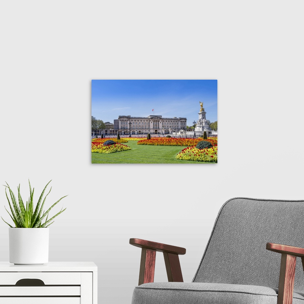 A modern room featuring United Kingdom, England, London, Buckingham Palace, facade of the palace in Spring showing the fl...