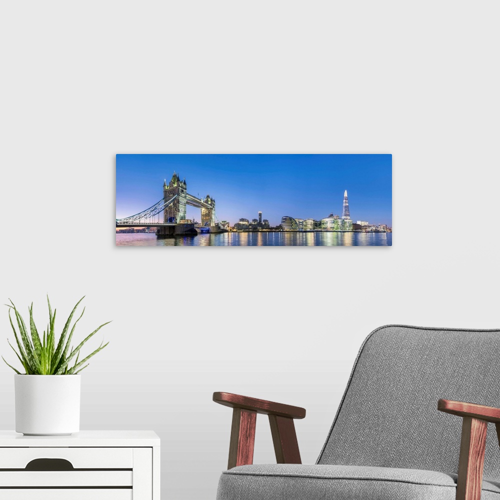 A modern room featuring United Kingdom, England, London. Tower Bridge and modern skyline of Southwark on the River Thames...