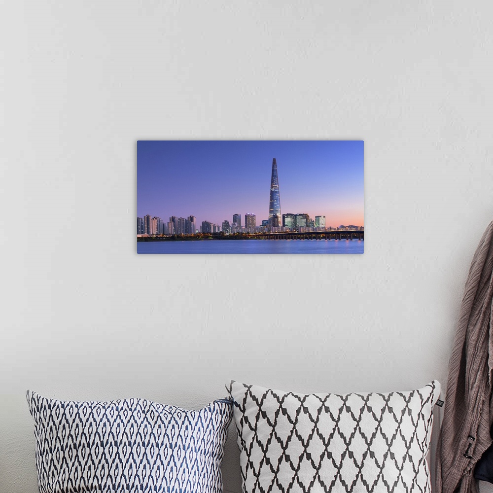A bohemian room featuring Lotte World Tower and Han River at dusk, Seoul, South Korea