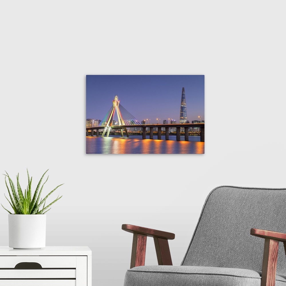 A modern room featuring Lotte World Tower and Olympic Bridge at dusk, Seoul, South Korea