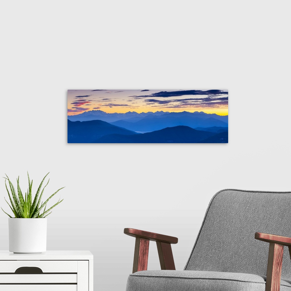 A modern room featuring View towards Swiss Alps from Monte San Salvatore illuminated at sunset, Lugano, Lake Lugano, Tici...