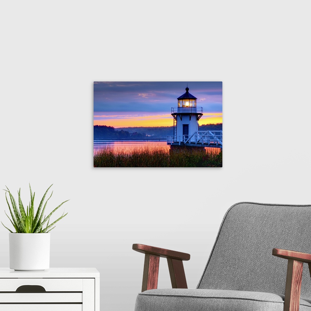 A modern room featuring USA. Maine. Doubling Point Light.