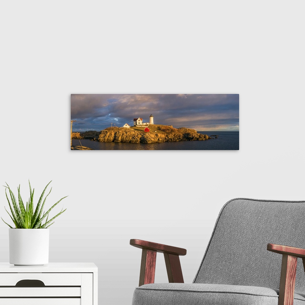 A modern room featuring USA, Maine, York Beach, Nubble Light Lighthouse with Christmas decorations, sunset.