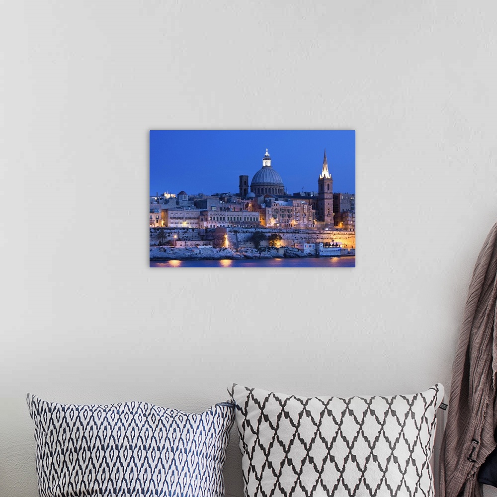 A bohemian room featuring Malta, Valletta, skyline with St. Paul's Anglican Cathedral and Carmelite Church from Sliema, dusk