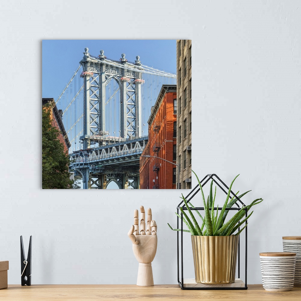 A bohemian room featuring Manhattan Bridge, view to Empire State Building, Dumbo, Brooklyn, New York City, USA.