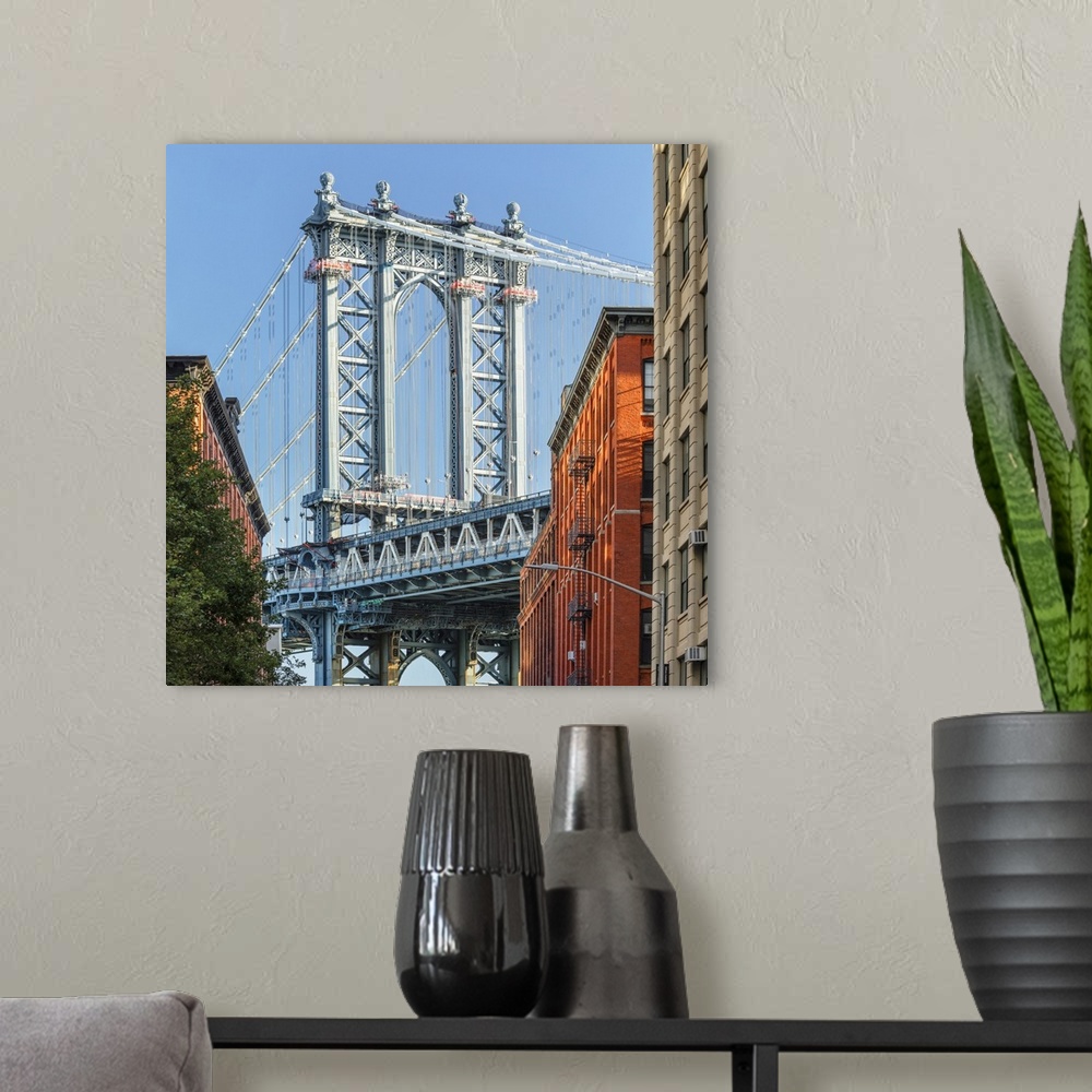 A modern room featuring Manhattan Bridge, view to Empire State Building, Dumbo, Brooklyn, New York City, USA.