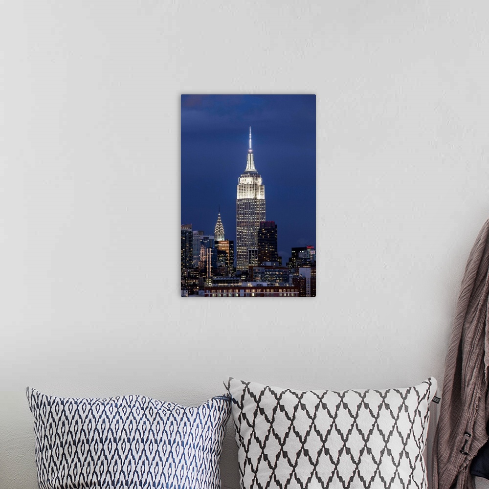 A bohemian room featuring Manhattan, view of the Empire State Building and Midtown Manhattan across the Hudson River, New Y...
