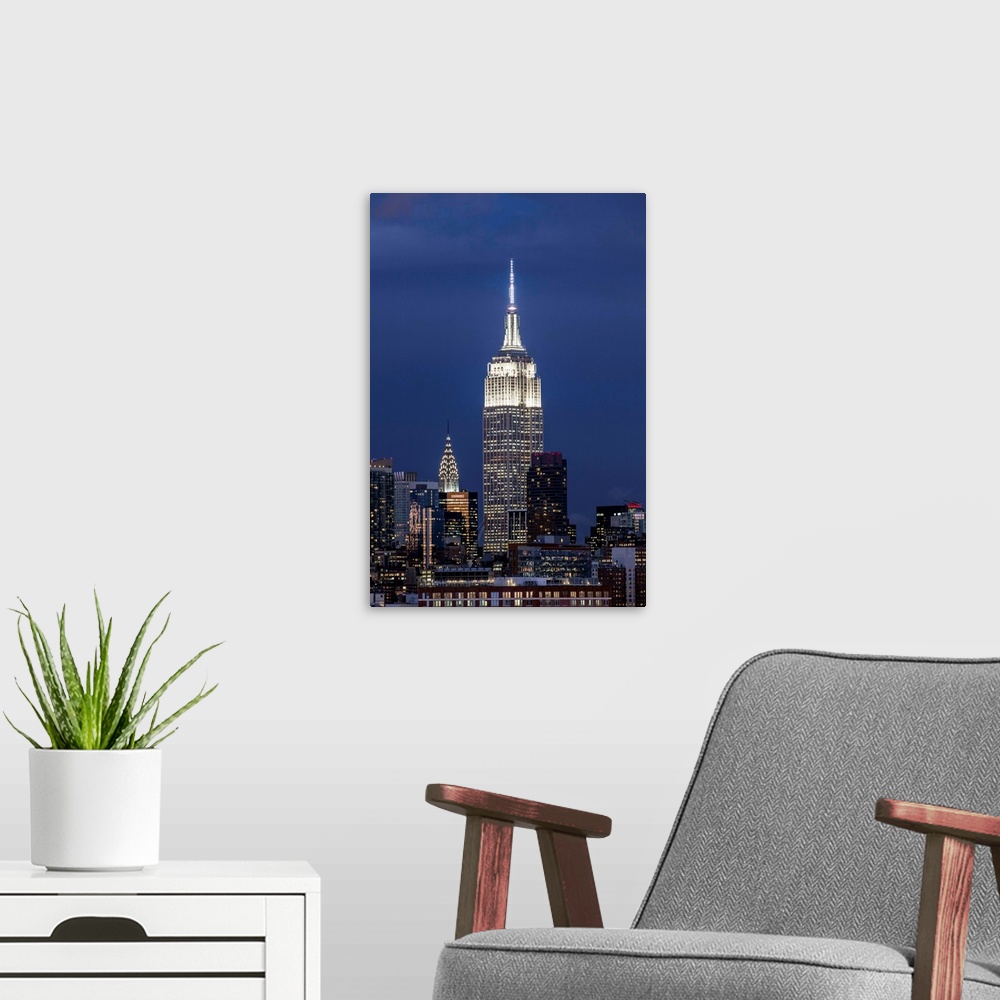 A modern room featuring Manhattan, view of the Empire State Building and Midtown Manhattan across the Hudson River, New Y...