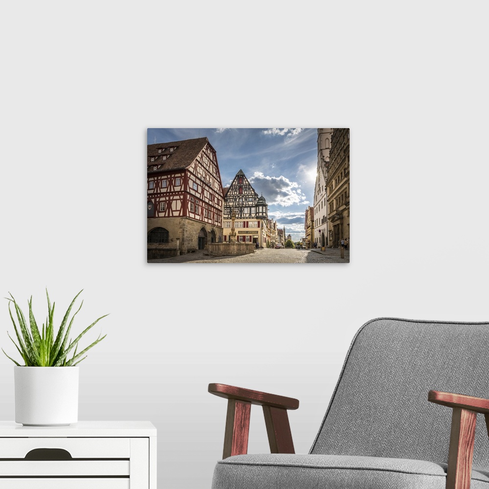 A modern room featuring Market Square fountain and historic houses in Herrngasse in the old town of Rothenburg ob der Tau...
