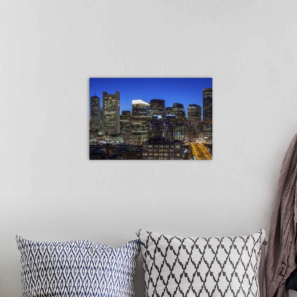 A bohemian room featuring USA, Massachusetts, Boston, elevated city skyline from South Boston, dusk.
