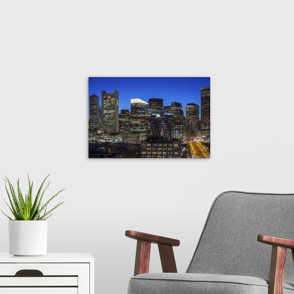 A modern room featuring USA, Massachusetts, Boston, elevated city skyline from South Boston, dusk.