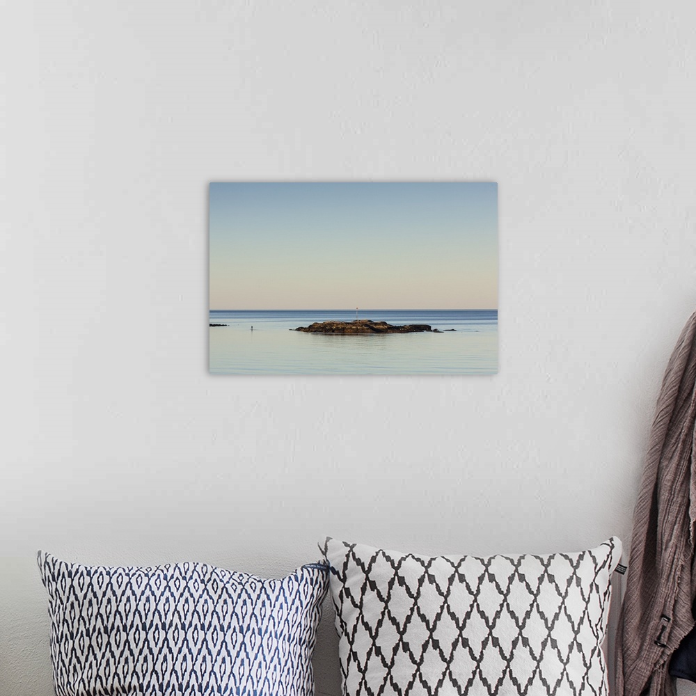 A bohemian room featuring USA, Massachusetts, Cape Ann, Rockport, paddleboarder in Rockport Harbor, dusk.