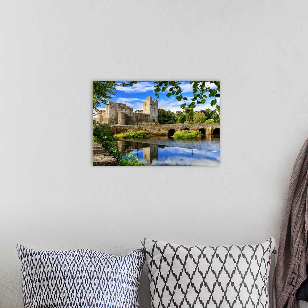 A bohemian room featuring Europe, Ireland, Caher, Tipperary, medieval town of Caher with fortress and bridge reflecting in ...