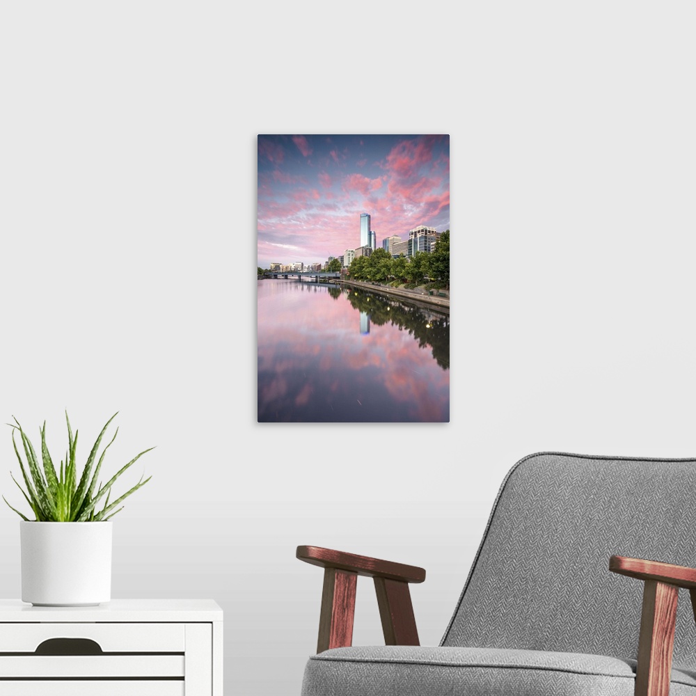 A modern room featuring Melbourne, Victoria, Australia. Yarra river and city at sunrise, with RIalto towers on the right
