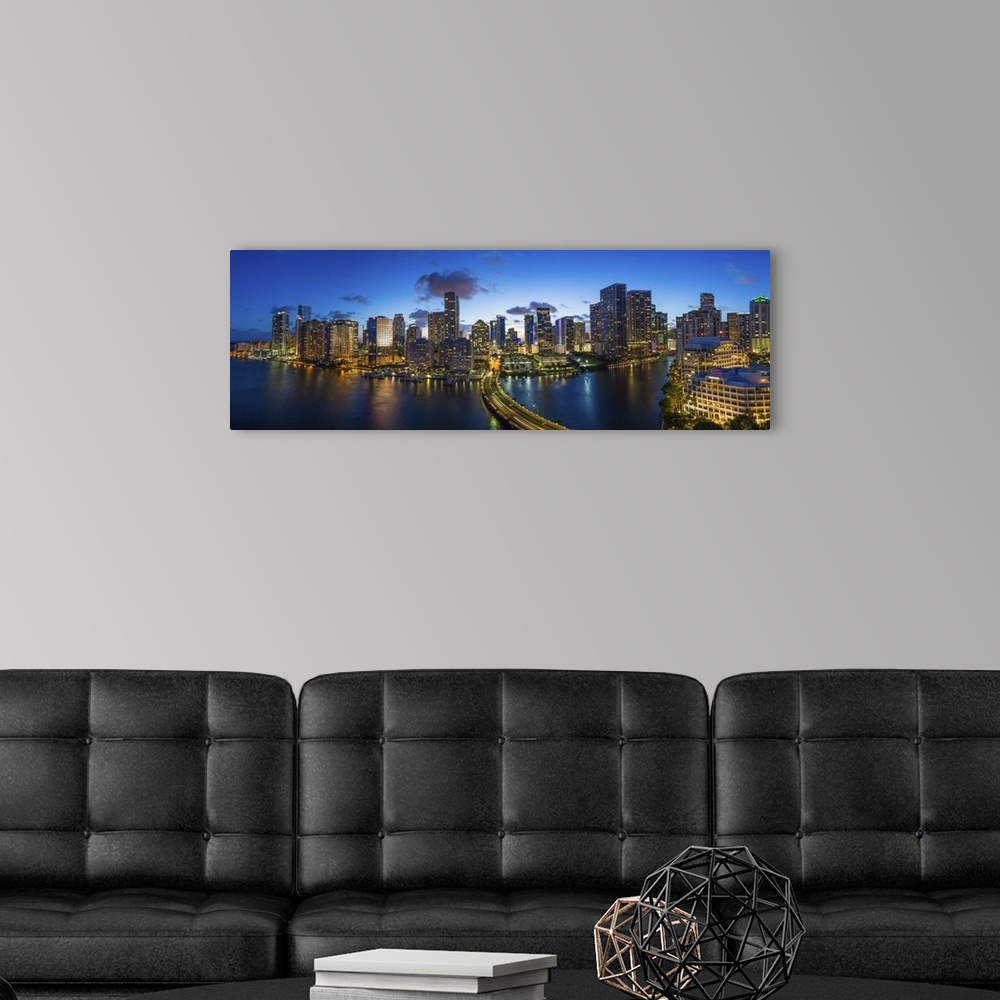 A modern room featuring View from Brickell Key, a small island covered in apartment towers, towards the Miami skyline, Mi...