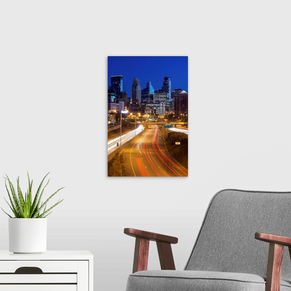 A modern room featuring USA, Minnesota, Minneapolis, city skyline from interstate highway I-35W, dawn