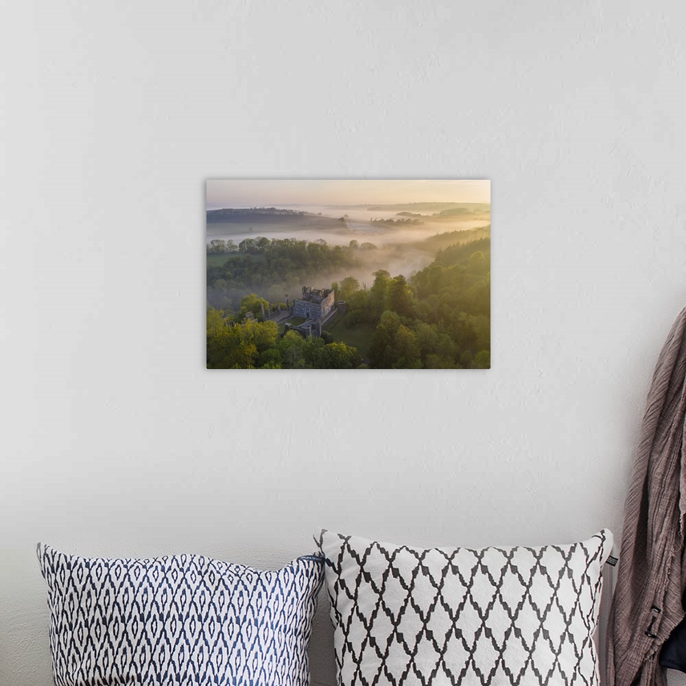 A bohemian room featuring Beautiful misty sunrise above Berry Pomeroy Castle, Devon, England