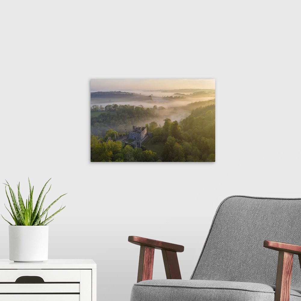 A modern room featuring Beautiful misty sunrise above Berry Pomeroy Castle, Devon, England