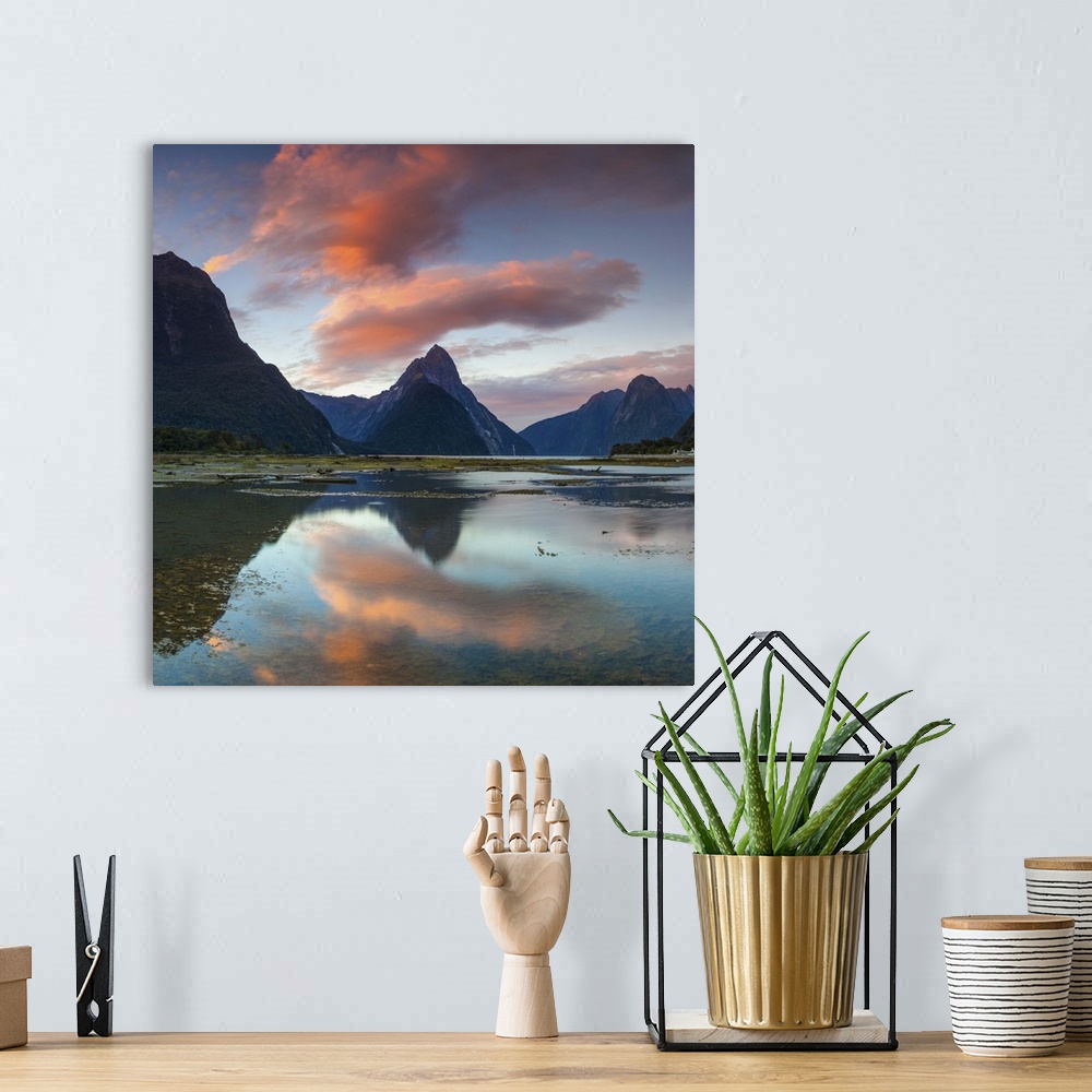 A bohemian room featuring The dramatic Mitre Peak illuminated at sunset, Milford Sound, Fiordland, South Island, New Zealand