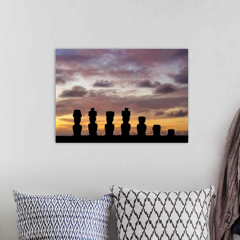 A bohemian room featuring Moais in Ahu Nau Nau by the Anakena Beach at sunset, Rapa Nui National Park, Easter Island, Chile