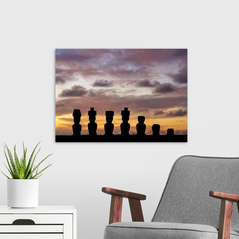 A modern room featuring Moais in Ahu Nau Nau by the Anakena Beach at sunset, Rapa Nui National Park, Easter Island, Chile