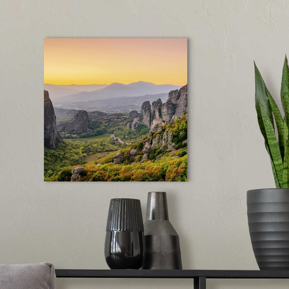 A modern room featuring View towards Monasteries of Rousanou and Saint Nicholas Anapafsas at dusk, Meteora, Thessaly, Greece
