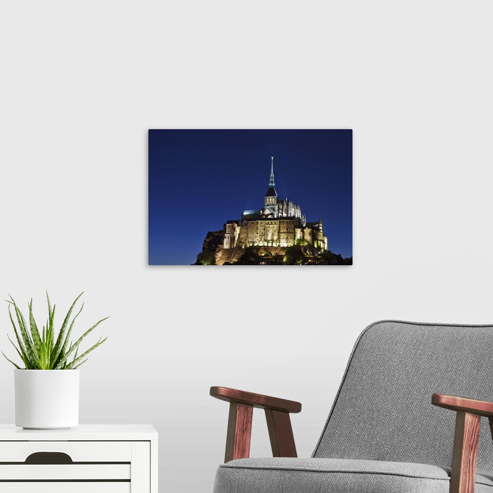 A modern room featuring Mont Saint Michel at night, Le Mont Saint Michel, Basse Normandie, France.