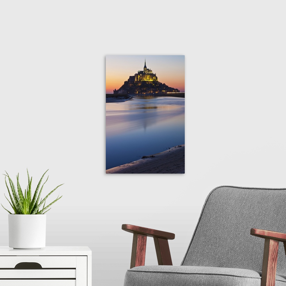 A modern room featuring Mont Saint Michel and its connection to the mainland via a tidal causeway with the River Couesnon...