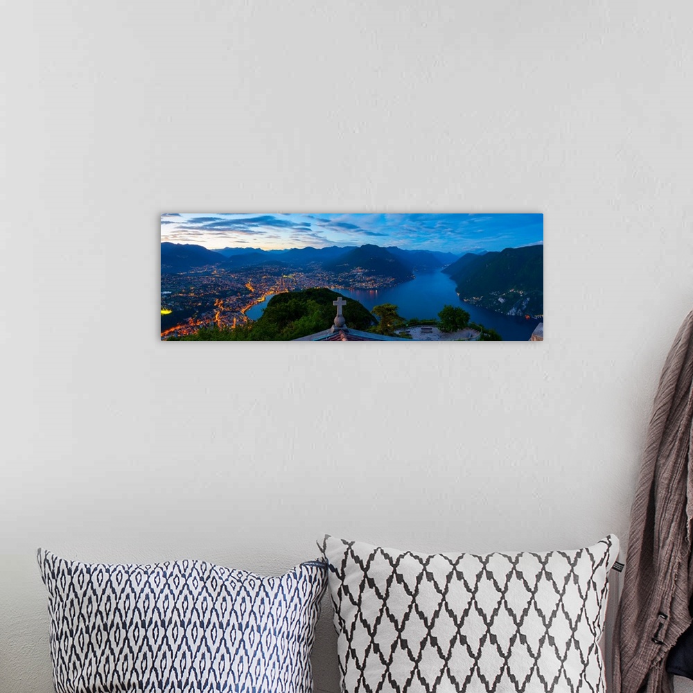 A bohemian room featuring Elevated view over Lugano from Monte San Salvatore illuminated at Dusk, Lake Lugano, Ticino, Swit...
