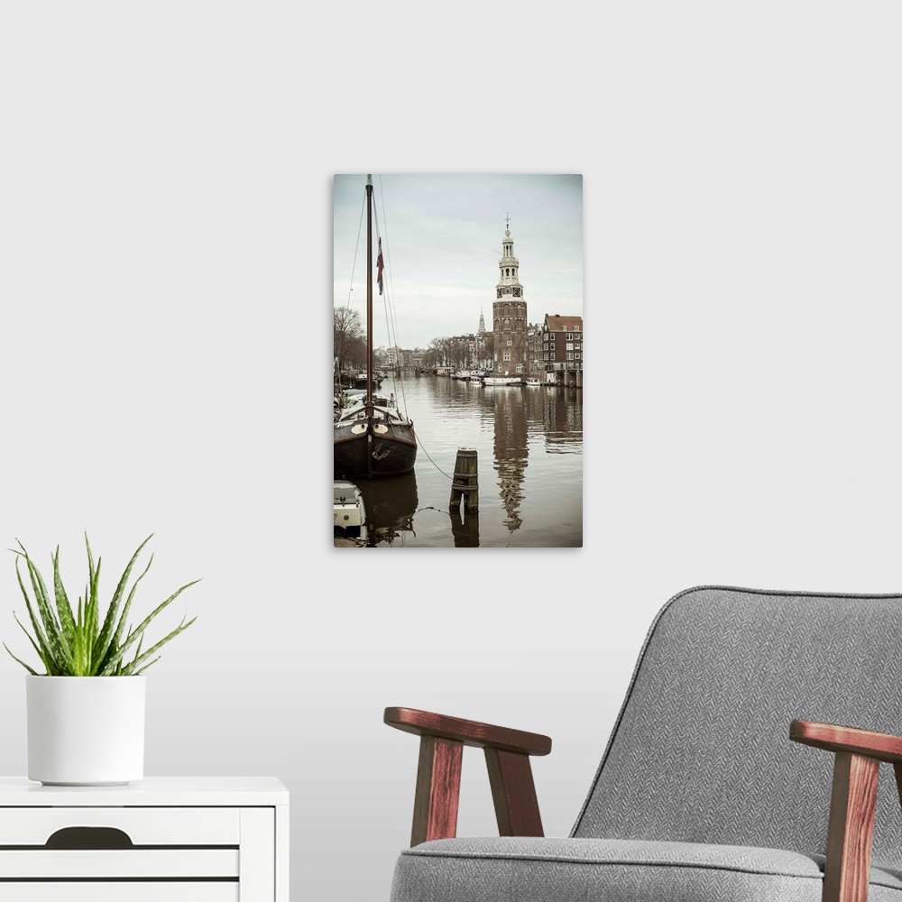 A modern room featuring Montelbaanstoren tower, Oudeschans canal, Amsterdam, Holland